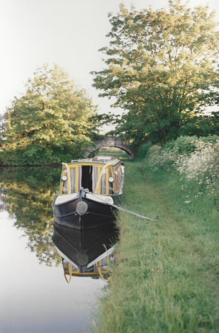 Canal boat with reflection